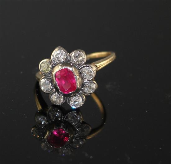 A yellow and white metal, ruby and diamond set oval cluster ring, (adapted),